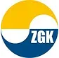 Logo składające się z okrągłego kształtu podzielonego na dwie części w kolorach żółtym i niebieskim z białą linią falistą oraz literami "ZGK" w dolnej, niebieskiej części.